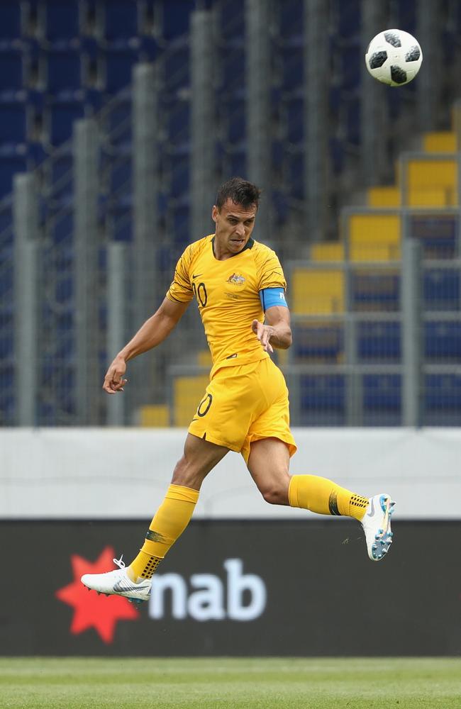 Trent Sainsbury clears a dangerous ball.