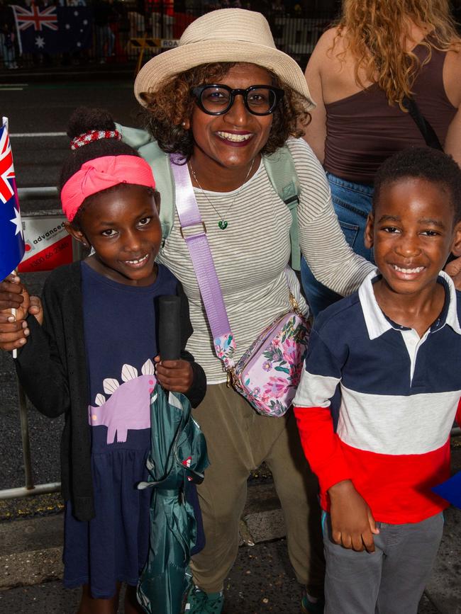 Thousands of people have braved the rain to gather in Brisbane for Anzac Day services. Picture: Grace Kessels