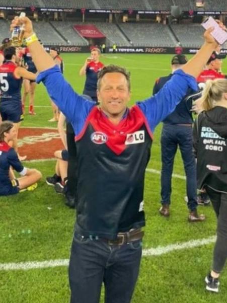 Hayden Burbank at Optus Stadium after the Demons won the AFL grand final.