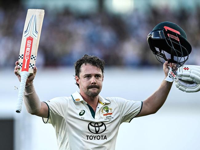 Australia's Travis Head gestures as he leaves the field after being dismissed for one hundred and forty on the second day of the second Test cricket match between Australia and India at the Adelaide Oval in Adelaide on December 7, 2024. (Photo by Michael ERREY / AFP) / -- IMAGE RESTRICTED TO EDITORIAL USE - STRICTLY NO COMMERCIAL USE --