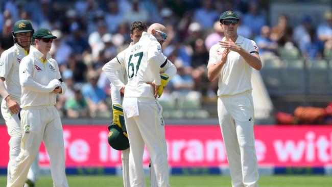 Pat Cummins signals for a review to dismiss Ollie Pope off the bowling of Nathan Lyon. Picture: Getty