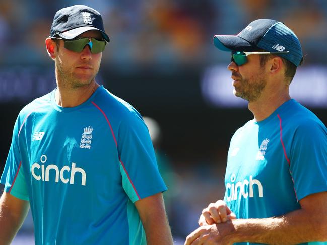 BRISBANE, AUSTRALIA - DECEMBER 11: Stuart Broad of England and James Anderson speak during warm up ahead of day four of the First Test Match in the Ashes series between Australia and England at The Gabba on December 11, 2021 in Brisbane, Australia. (Photo by Chris Hyde/Getty Images)