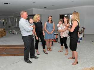 Michael (holding Connor Hain) and Suzi McEachern, Early Childhood teacher Alison Christian, mum Natalie Hain and Lucy and mum Jess and Zahlee Rozynski at the Moreton Drive Early Learning Centre. Picture: Tony Martin