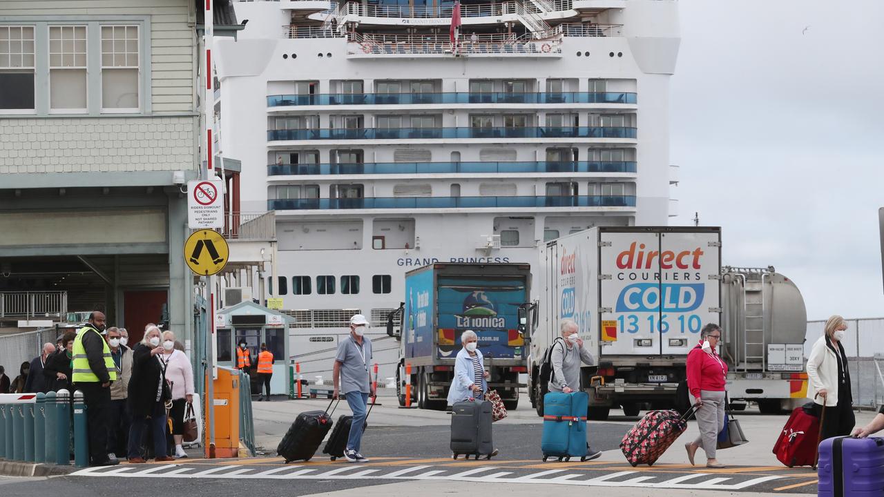 Masked Grand Princess cruise ship passengers disembark. Picture: David Crosling