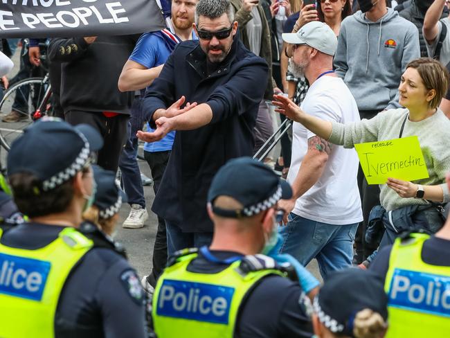 Protesters face off with police in Melbourne.