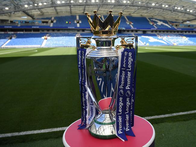 (FILES) In this file photo taken on August 12, 2017 The Premier league trophy sits beside the pitch ahead of the English Premier League football match between Brighton and Hove Albion and Manchester City at the American Express Community Stadium in Brighton. - Premier League clubs will meet on May 1, 2020, to discuss whether it is realistic to complete the season during the coronavirus crisis or whether they will have to brace for a devastating financial hit. (Photo by CHRIS J RATCLIFFE / AFP) / RESTRICTED TO EDITORIAL USE. No use with unauthorized audio, video, data, fixture lists, club/league logos or 'live' services. Online in-match use limited to 75 images, no video emulation. No use in betting, games or single club/league/player publications. /