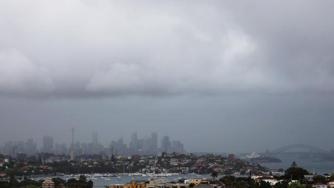 A storm moves in over Sydney from the south bringing rain and lightning. Picture: John Grainger