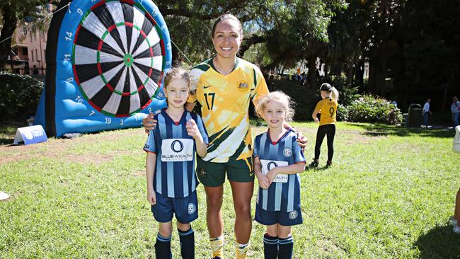 Kyah Simon with young fans. Picture: Adam Yip