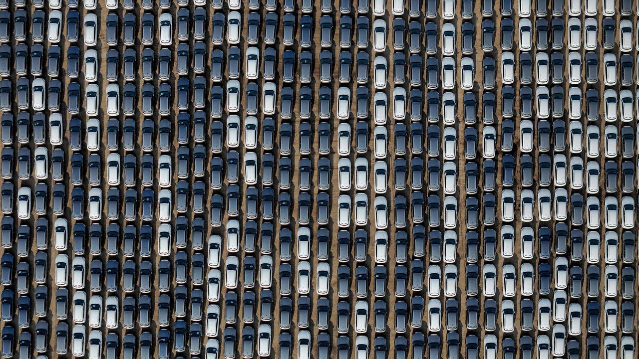 BYD electric cars for export waiting to be loaded onto a ship at a port in Yantai, in eastern China's Shandong province. Photo by AFP) / China OUT