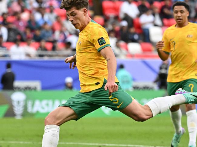 Australia's defender #05 Jordan Bos shoots the ball during the Qatar 2023 AFC Asian Cup Group B football match between Australia and India at the Ahmad bin Ali Stadium in Al-Rayyan, west of Doha on January 13, 2024. (Photo by HECTOR RETAMAL / AFP)