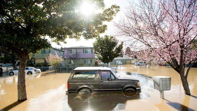 A Ford Bronco rests in floodwaters in the Rock Springs area of San Jose, California in 2017. The IPCC says the link between rainfall and flooding is complex. Picture: AFP