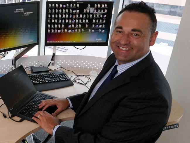 State manager Con Tragakis at a stand-up desk at the Adelaide office.