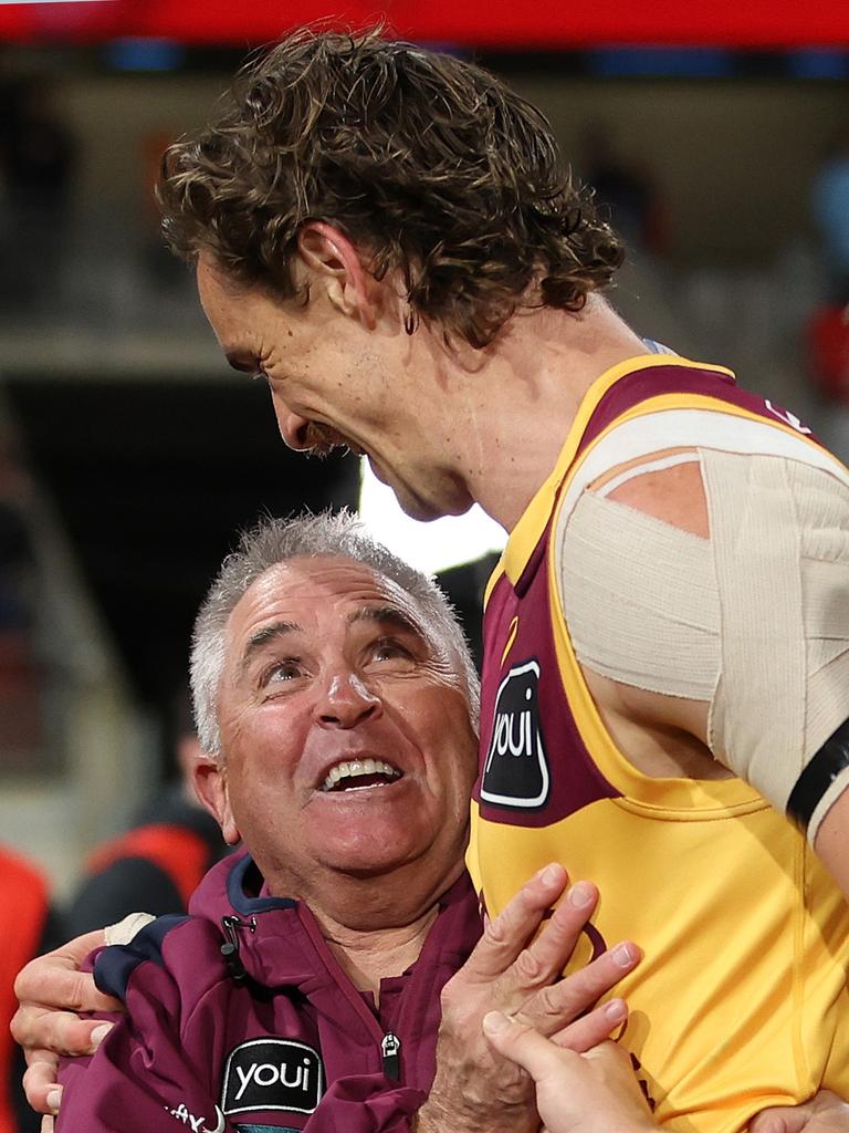 SYDNEY, AUSTRALIA - SEPTEMBER 14: Chris Fagan, Senior Coach of the Lions celebrates with Joe Daniher of the Lions after victory during the AFL First Semi Final match between GWS Giants and Brisbane Lions at ENGIE Stadium, on September 14, 2024, in Sydney, Australia. (Photo by Mark Metcalfe/AFL Photos/via Getty Images)