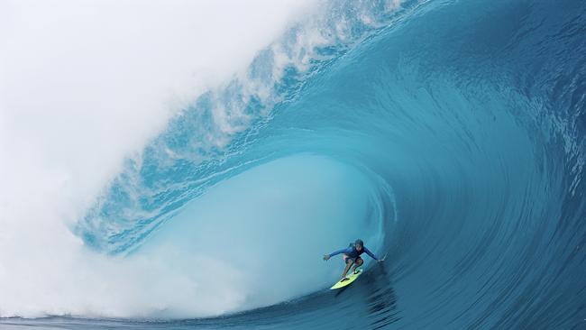 Matahia Drollet at the tender age of 16 is towed in to one of the most perfect waves of the season by his brother Manoa, who is one of the most respected surfers ever at Teahupoo in Tahiti. Picture: Ted Grambeau