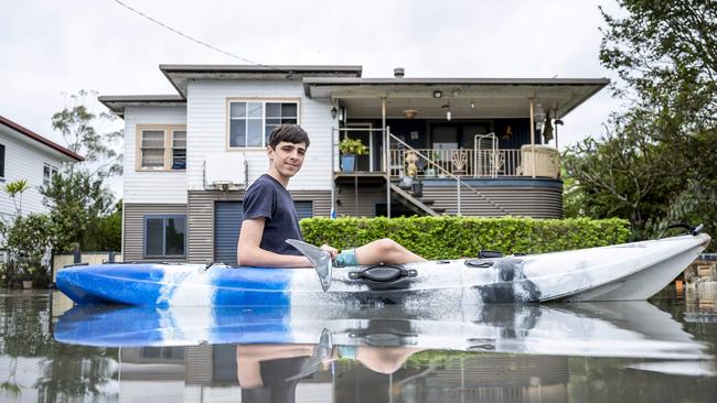 Logan Ferris paddles his kayak out the front of his family’s home. Picture: Darren Leigh Roberts