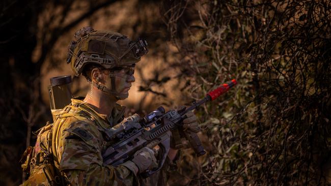 An Australian army soldier from the 3rd Battalion, Royal Australian Regiment, on patrol prior to a section attack during the 2022 Duke of Gloucester Cup in Singleton. *** Local Caption *** Australian Army infantry soldiers from across Australia tested their core skills for the prestigious Duke of Gloucester Cup at the School of Infantry, near Singleton in NSW, July 31 - August 5 2022. The Duke of Gloucester Cup is the Armyâ€™s premier military skills competition, pitting the best Royal Australian Corps of Infantry rifle sections from each unit against one another through a series of challenging activities that test their core infantry skills, including marksmanship, tactics, teamwork and fitness. Along with the Duke of Gloucester Cup, five other trophies are awarded: Sir Arthur MacDonald Trophy for best foundation war-fighting skills; Gurkha Trophy for best live-fire shooting; Royal Ulster Rifles Trophy for best falling plate shooting; OSCMAR Trophy for best battle endurance; and the DSM Roche CSC Memorial Cup for best individual soldier. The Duke of Gloucester Cup was created by Prince Henry, Duke of Gloucester, in 1946, while serving as the Governor-General of Australia.