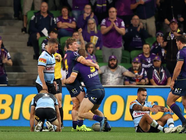 Tom Eisenhuth celebrates with Harry Grant after scoring a try. Picture: Robert Cianflone/Getty Images