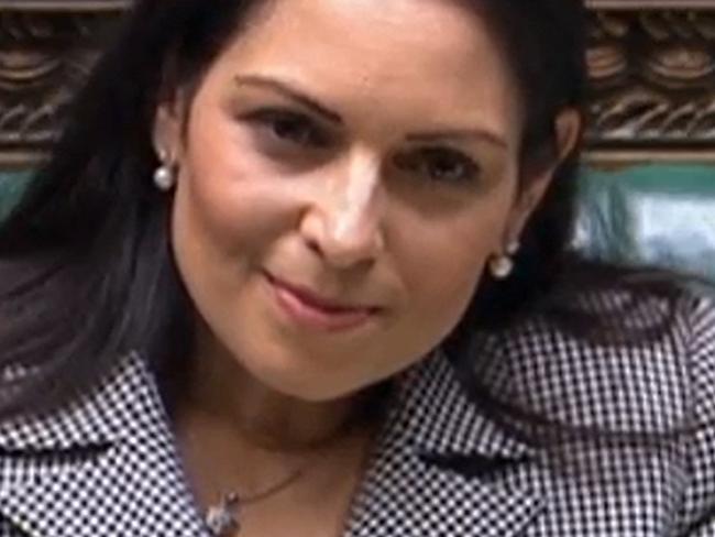A video grab from footage broadcast by the UK Parliament's Parliamentary Recording Unit (PRU) shows Britain's Home Secretary Priti Patel gesturing as she gives a statement concerning the government's plan to send migrants and asylum seekers who cross the Channel to Rwanda, in the House of Commons, in London, on June 15, 2022. - Britain vowed Wednesday it would pursue its controversial policy to deport asylum seekers to Rwanda after a first flight was cancelled following a legal ruling, in an embarrassing blow to Prime Minister Boris Johnson's government. The number of those due to be put on the flight on Tuesday had dwindled from an original 130 to seven and finally none after a last-minute order by the European Court of Human Rights (ECHR). (Photo by PRU / AFP) / RESTRICTED TO EDITORIAL USE - MANDATORY CREDIT 