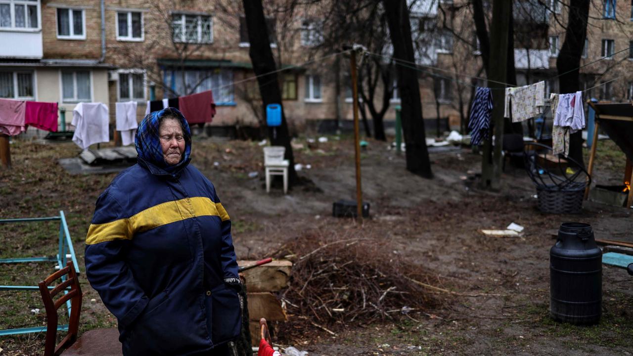 An elderly woman cries near her house in Bucha. Picture: Ronaldo Schemidt/AFP