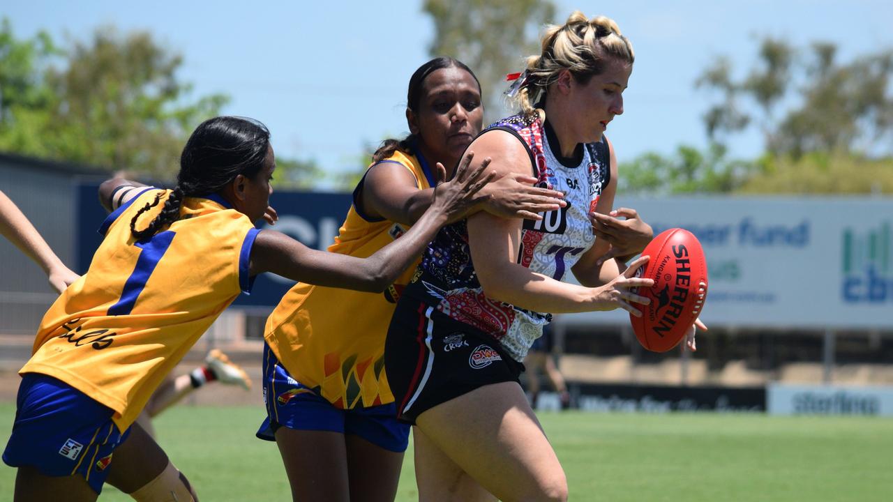 Southern Districts WPL captain Megan Craufurd tackled by Wanderers players during their Round 7 clash at TIO Stadium (2023-24 season). Picture: Alison McGowan / AFLNT Media