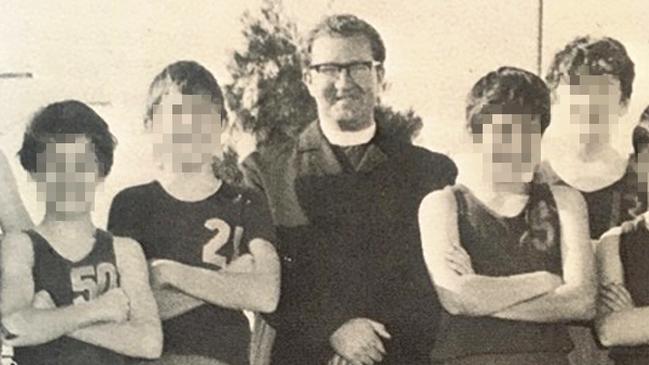 Brother Victor Higgs with members of the St Ignatius College under-13 basketball team in 1970.