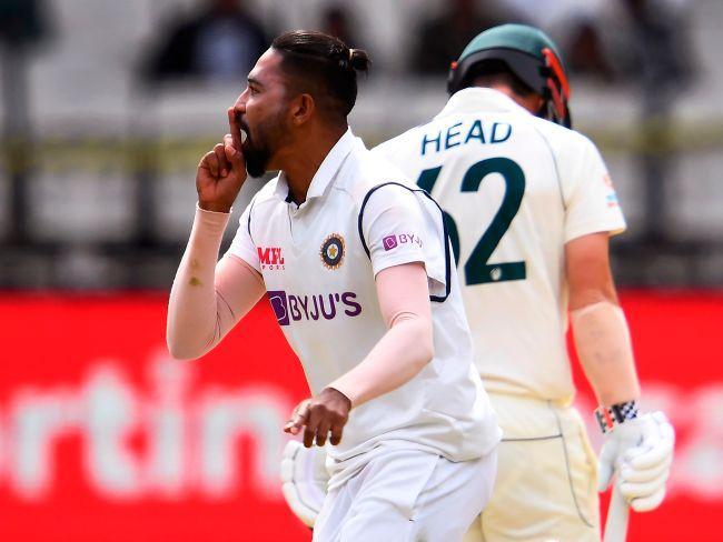 India's Mohammed Siraj (L) celebrates the dismissal of Australia's Travis Head (R). Picture: AFP