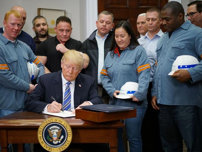 US President Donald Trump declared the American steel and aluminium industries had been "ravaged by aggressive foreign trade practices" as he signed off on contentious trade tariffs this week. Picture: AFP/Mandel Ngan