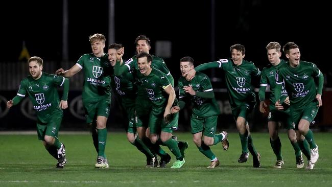 Bentleigh Greens celebrate after defeating Hme City in a penalty shootout.