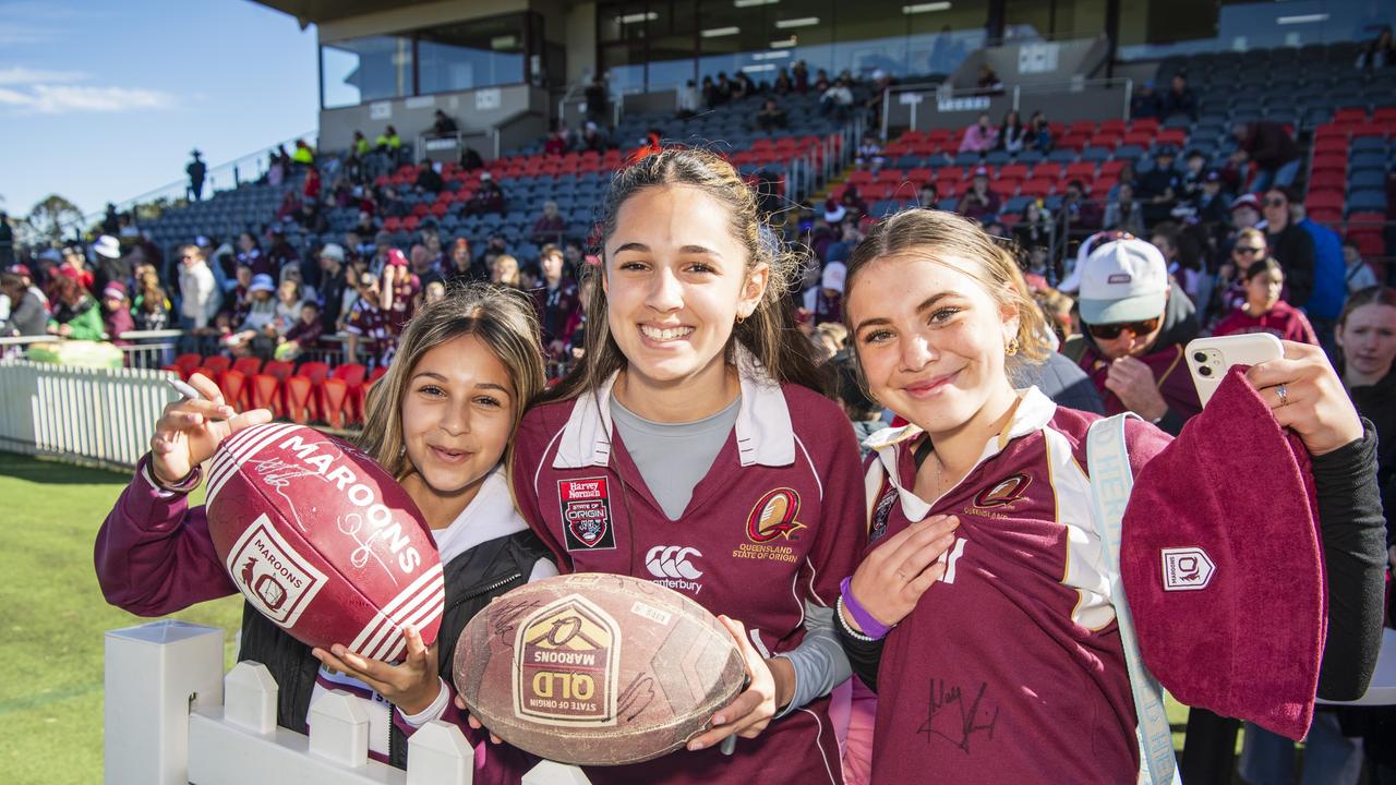 Showing off the signatures gathered are (from left) Elmira Shatalee (celebrating her 12th birthday), Yasamin Shatalee and Harriett Ingram at Queensland Maroons fan day are at Toowoomba Sports Ground, Tuesday, June 18, 2024. Picture: Kevin Farmer