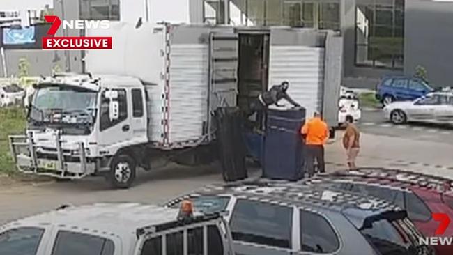 Channel 7 screengrabs of CCTV footage show the removalists at the Ariele Apartments in Maribyrnong.