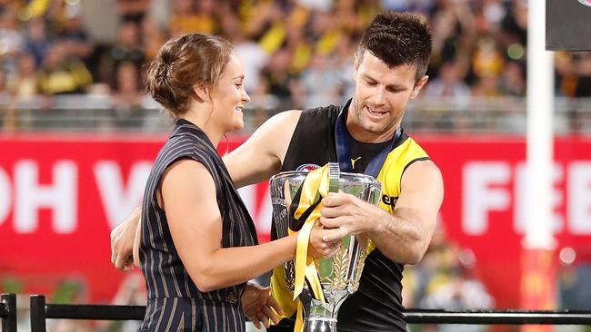 Diehard Tigers fan Ash Barty presents Richmond captain Trent Cotchin with the AFL premiership cup. Picture: AFL Photos via Getty Images