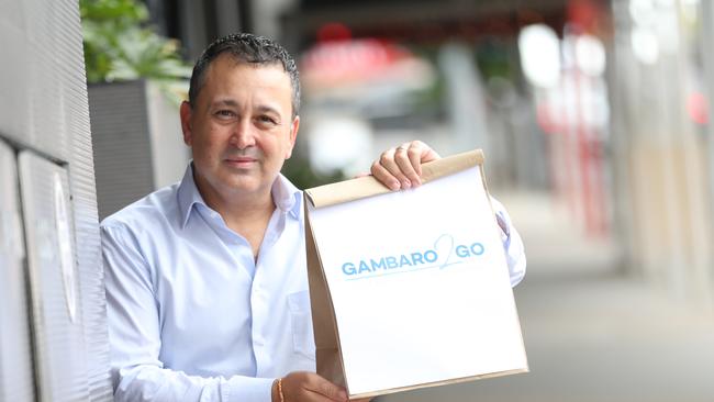 John Gambaro holds a A Gambaro 2 Go takeaway bag. Picture: Peter Wallis