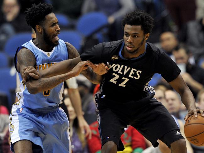 Denver Nuggets forward Will Barton, left, guards Minnesota Timberwolves guard Andrew Wiggins.