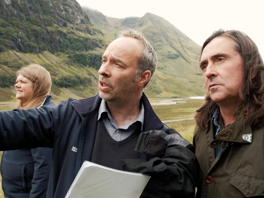 Historian Neil Oliver, right, examines the excavation site in Glencoe with the National Trust of Scotland. Picture: NTS