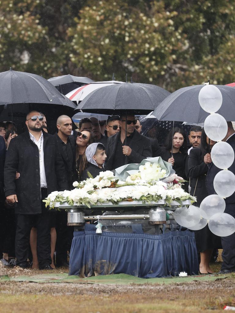 Family and friends gather at the funeral of Marina Morgan.