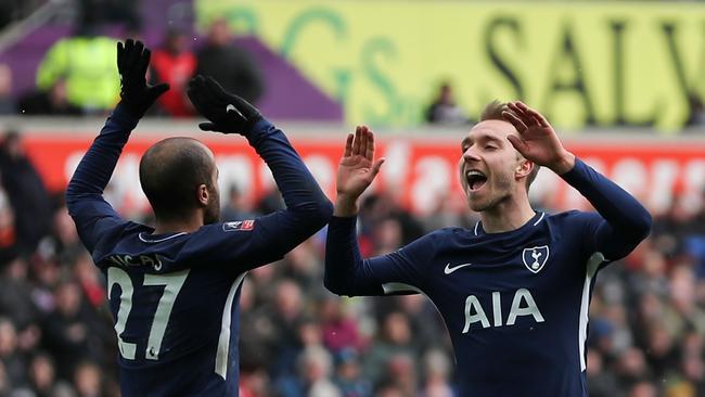 Tottenham Hotspur's Danish midfielder Christian Eriksen (R) celebrates scoring their third goal with Tottenham Hotspur's Brazilian midfielder Lucas Moura (L)