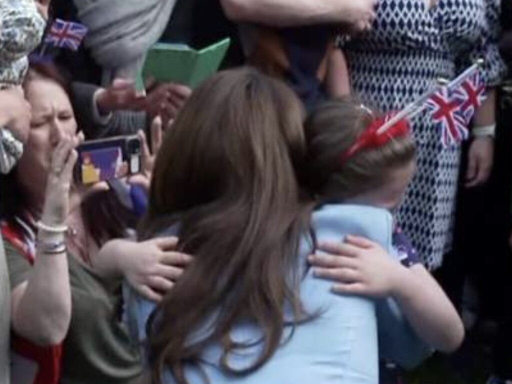 Kate was seen hugging a young girl.