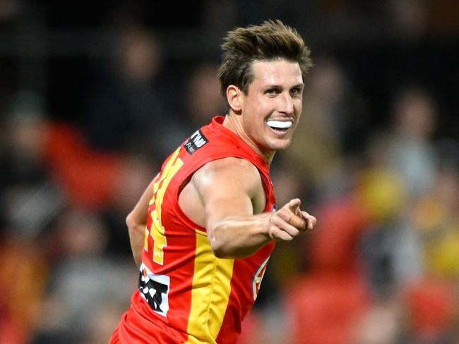 GOLD COAST, AUSTRALIA - JUNE 25: David Swallow of the Suns celebrates kicking a goal during the round 15 AFL match between Gold Coast Suns and Hawthorn Hawks at Heritage Bank Stadium, on June 25, 2023, in Gold Coast, Australia. (Photo by Matt Roberts/AFL Photos/via Getty Images )