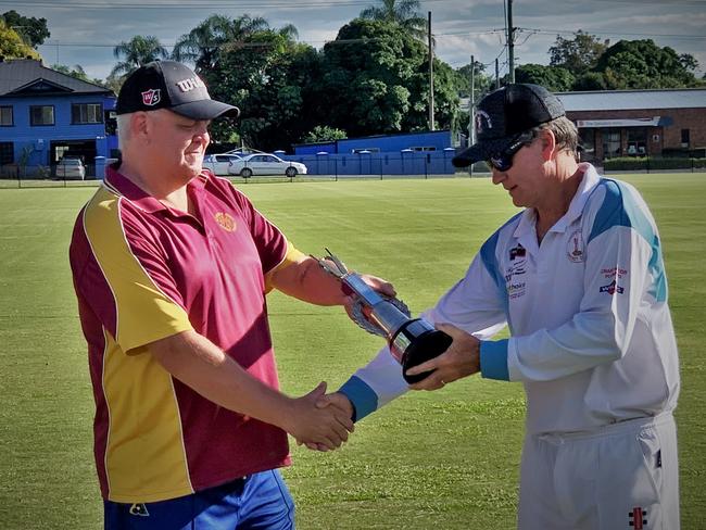 Clarence River Cricket Association's Tim Kinnane presents Coutts Crossing captain Scott Chard with the GDSC 3rd Grade premiership trophy after winning the grand final against Brothers Jimmy Watters Painting/Hello Travelworld by three wickets at Lower Fisher Synthetic on Saturday, 27th March, 2021.