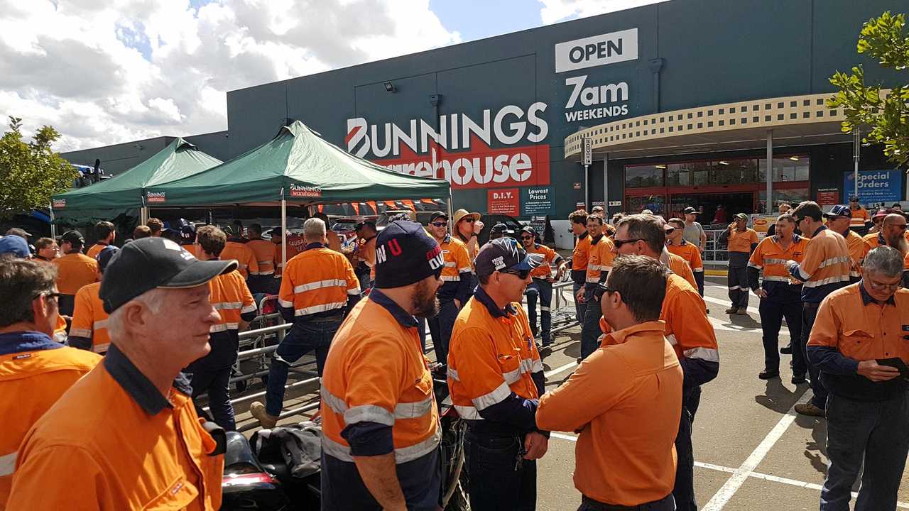 Workers at Downer EDI's Maryborough factory walked off the site on strike on Monday morning. The workers gathered in the Bunnings Warehouse car park and presented a cheque from their own money to the Farmers Drought Appeal. Picture: Blake Antrobus
