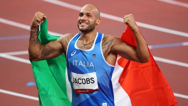 Lamont Marcell Jacobs celebrates after winning gold in the Men's 100m Final. (Photo by Abbie Parr/Getty Images)