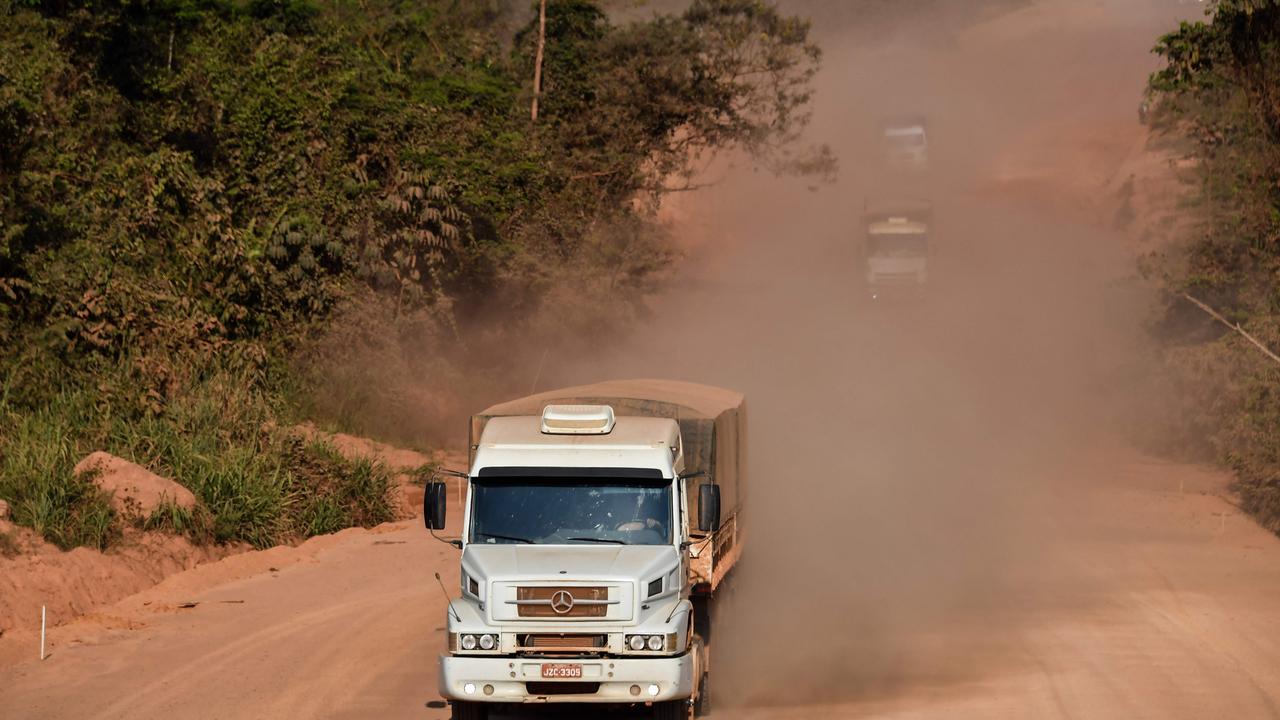 A truck drives along a section under construction of the Trans-Amazonian highway (BR230) near Itaituba, Para state. In the wet season, the road becomes almost impassable. (Photo by Nelson Almeida / AFP)