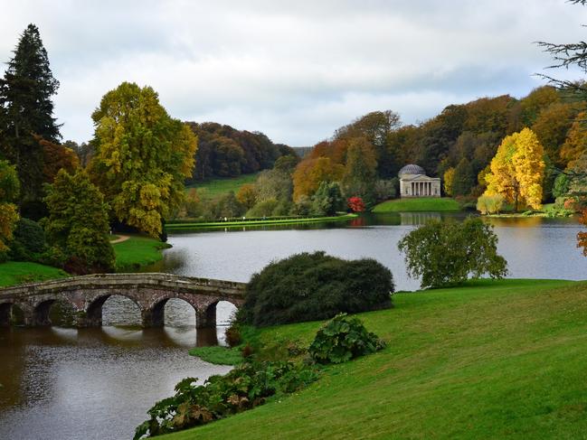 Autumn scene beside a lake in the English County of Somerset.Stourhead Gardens, England