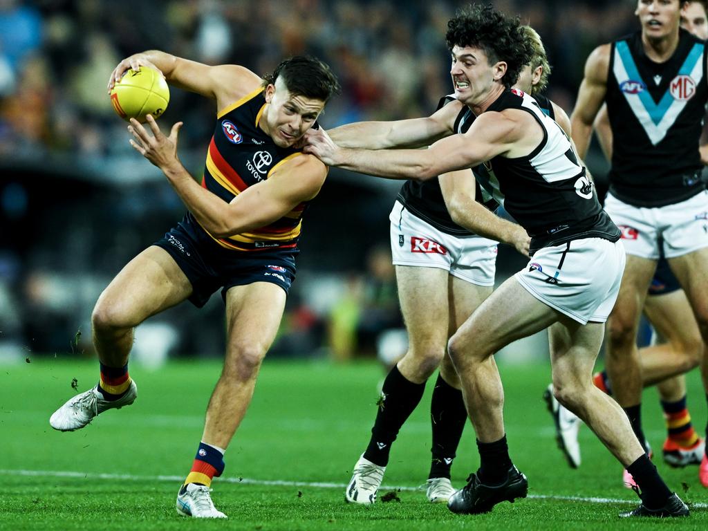 Jake Soligo bursts through a tackle attempt from Darcy Byrne-Jones. Picture: Mark Brake/Getty Images