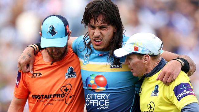 SYDNEY, AUSTRALIA - MARCH 23: Tino Fa'asuamaleaui of the Titans is helped from the field during the round three NRL match between Canterbury Bulldogs and Gold Coast Titans at Belmore Sports Ground, on March 23, 2024, in Sydney, Australia. (Photo by Brendon Thorne/Getty Images)