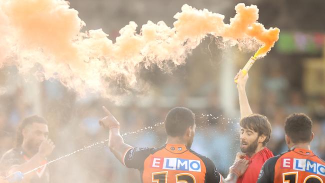 George with the lit flare on the field. Picture: Getty Images