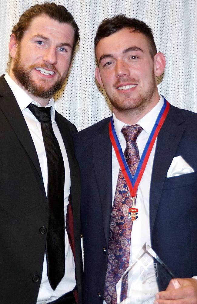 Luke Tynan with Port Melbourne great Toby Pinwill after his 2017 best and fairest.