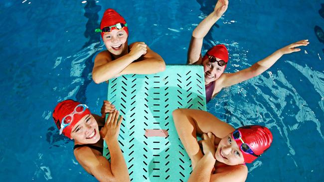 Country kids L-R Charlize Paterson from Gol Gol, Seinna Bevan from Broken Hill, Scarlett Molloy from Broken Hill and Jacinta Morrison from Gol Gol compete at the NSW state primary swimming championships at Sydney Olympic Park this week. Picture: Toby Zerna