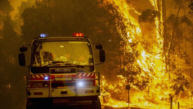 RFS Firefighters battling the Currowan blaze. Picture: Gary Ramage