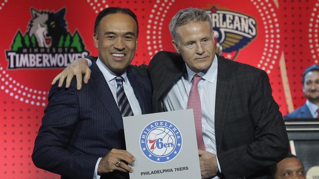 NBA deputy commissioner Mark Tatum, left, poses for a photo with Philadelphia 76ers head coach Brett Brown.